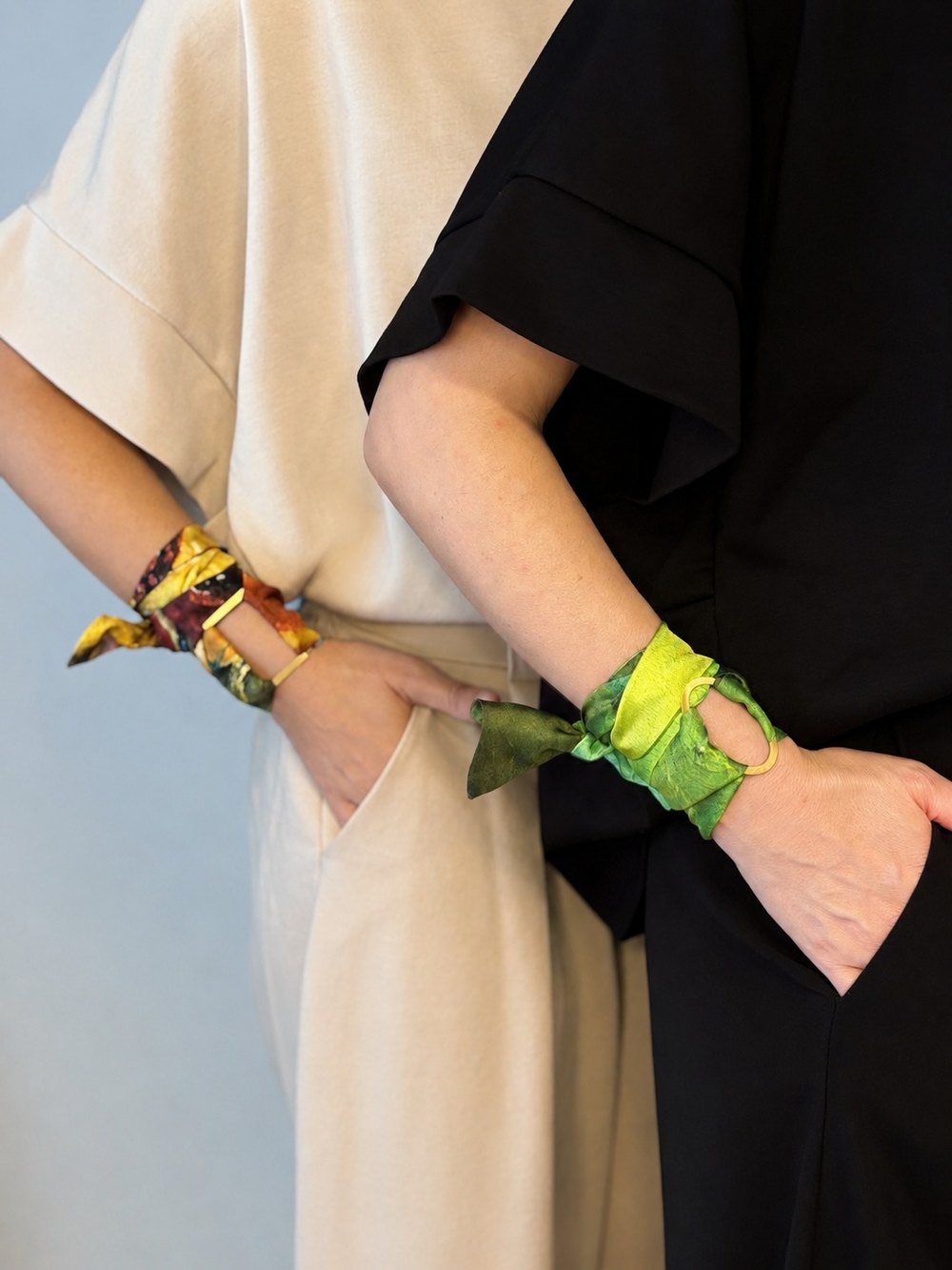 Silk scarves worn around wrists