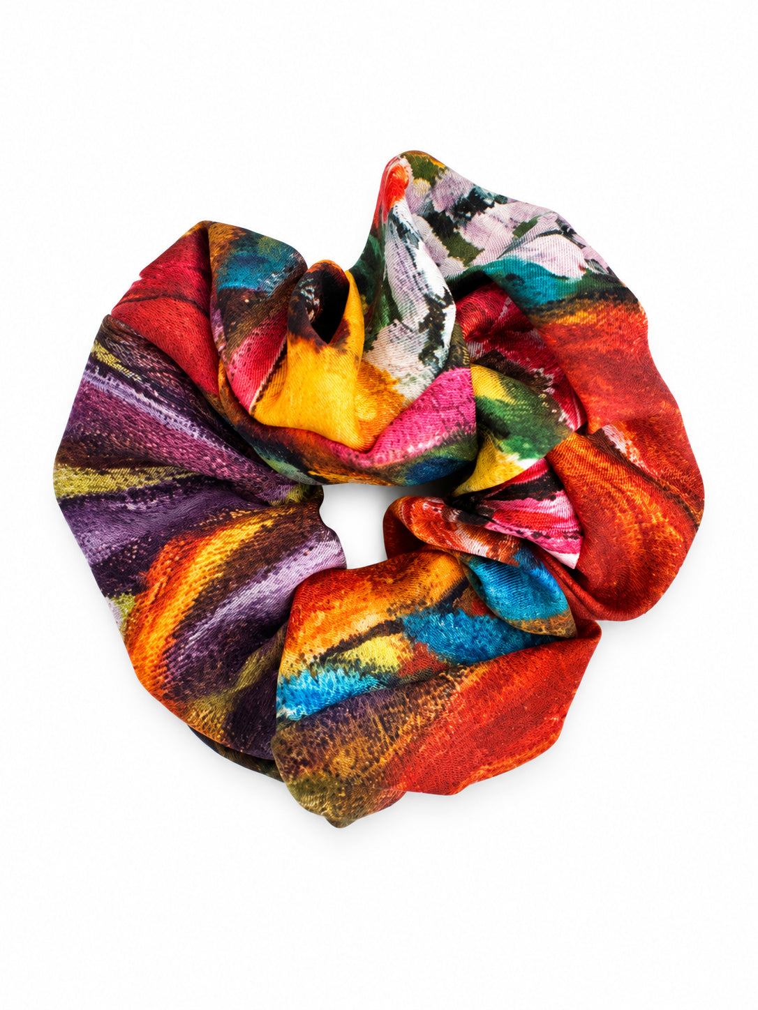 A multicolor scrunchie featuring an abstract painterly pattern with vibrant shades of red, orange, yellow, blue, green, purple, and pink on a white background.